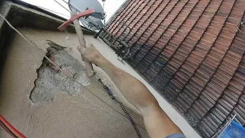 High Rise Worker Restoring Infiltration Scraping External Wall,Point of View Stockbeeldmateriaal 78449897