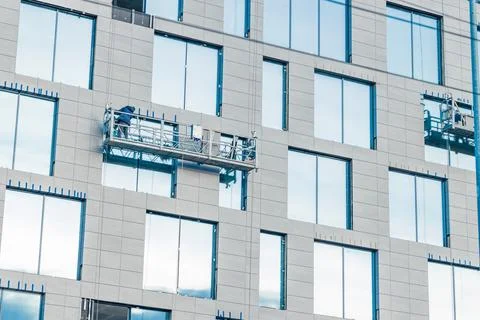 High rise working external wall of skyscraper building gray wall facade windo Fotos de archivo