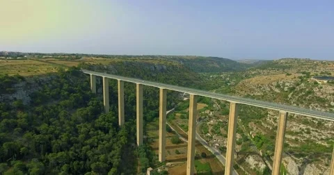 High road bridge connecting mountain valley Stock-Footage 64876940