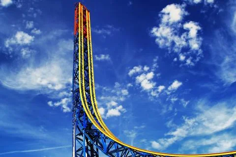 High roller coaster and cloudy blue sky Stock Photos