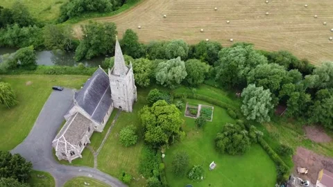 High Rotating Drone Shot of Marden Church, River, and Surrounding Fields Stock Footage 281852014