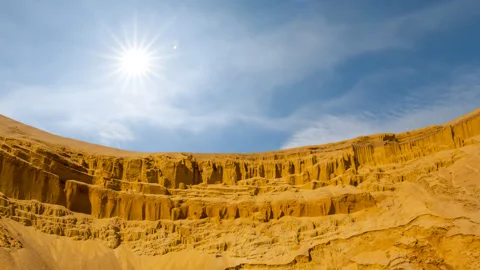 High sandy desert dune in light of sparkle sun Stock Footage 250154617