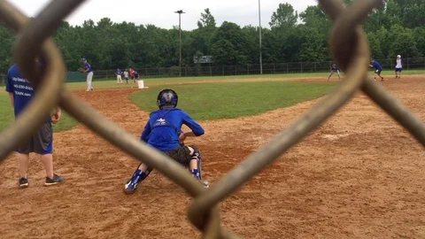 High school baseball players trying out for travel baseball program run Stock Footage 104323559