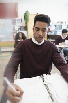 High school boy student studying in classroom Stock Photos