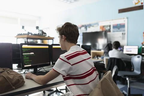 High school boy student using computer in classroom Foto stock