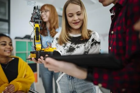 High school classmates exploring robotics, technology and engineering together. Stock Photos