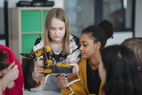 High school classmates exploring robotics, technology and engineering together. Stock Photos