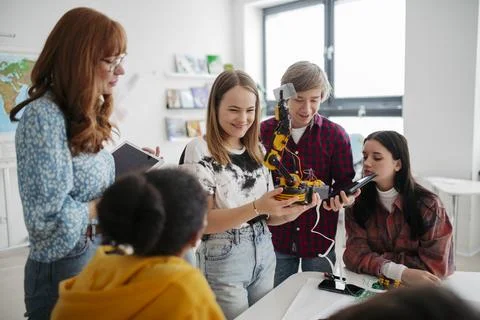 High school classmates exploring robotics, technology and engineering together. Stock Photos