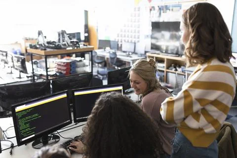 High school girl students using computers in classroom Stock Photos