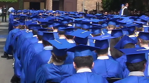 High school graduating class assembled for ceremony Stock Footage 148571511