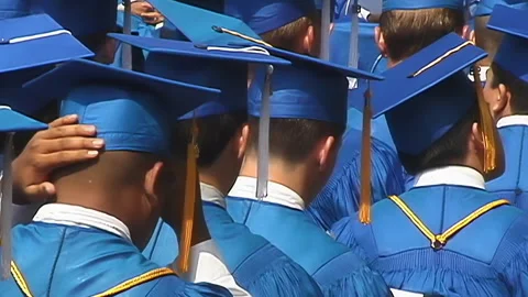 High school graduating class assembled for ceremony Stock Footage 148573307