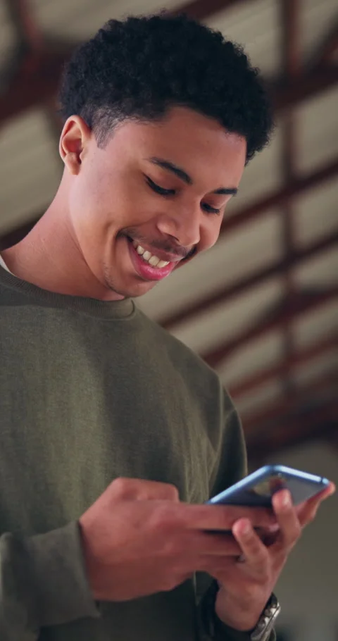 High school, happy and boy with phone typing for social media, online chat and Stock Footage 340973629