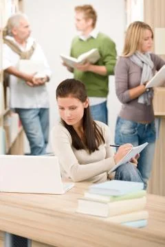 High school library - student with note pad Stock Photos