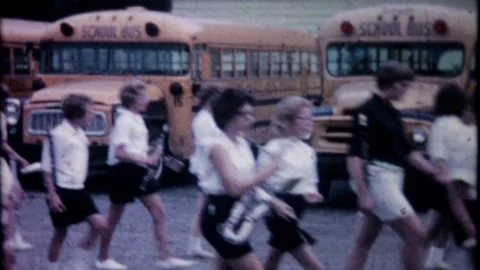 High school marching band gets off bus and lines up for a parade 7831 Stock Footage 305338337