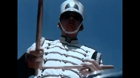 A high school marching band marches with a drill team in Maryville, Tennessee, Stock Footage 79419600