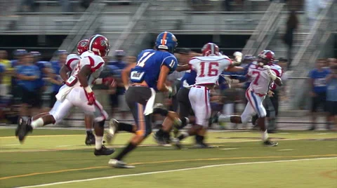 High School Quarterback Keeps the Ball For the First Down Video stock 51698611