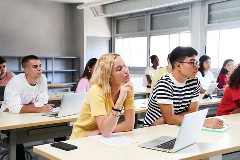 High school science class: A boy and girl using a laptop computer while 스톡 사진