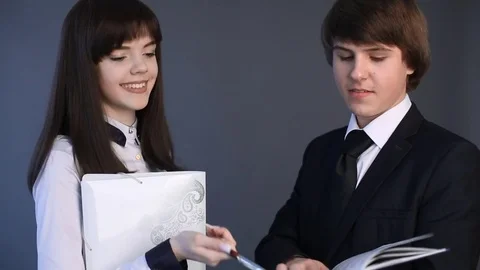 High school student Couple in uniform talking with each other. Closeup portrait 스톡 동영상 74261816