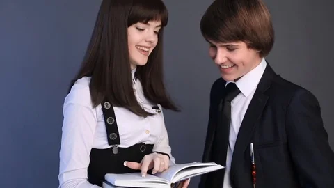 High school student couple in uniform talking with each other. Closeup portrait Video stock 74262004