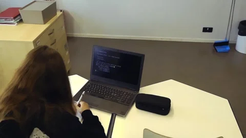 High school student learning computer programming in a modern classroom Видео 345479972