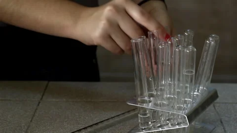 High School Student Organizing Test Tubes in Chemistry Classroom. Close Up. 4K. Stock Footage 278677703