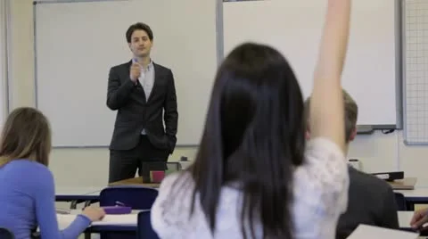 High school student raises hand Stock Footage 22665325
