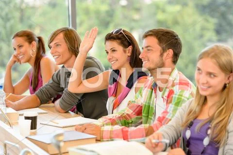 High-school student raising her hand in class Stock Photos