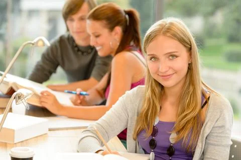 High-school student taking notes in study room Stock Photos
