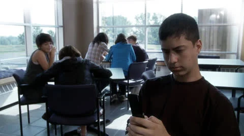 High school student texting and ignoring other people Stock Footage 25570081