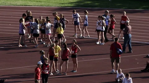 High school students and a coach before a track and field meet. Stock Footage 52704872