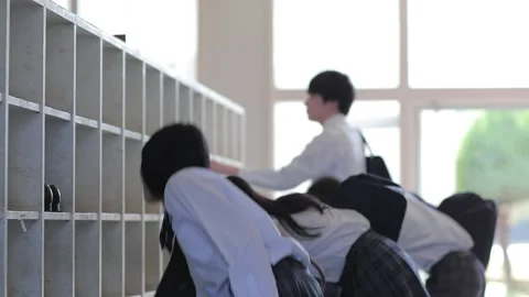 High school students changing shoes Stock Footage 161855536
