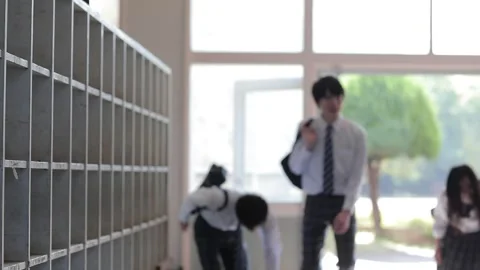 High school students changing shoes Stock Footage 161855569