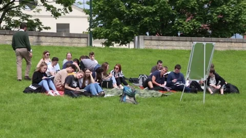 High school students during a lesson in the open air on the river embankment. Stock Footage 155203260