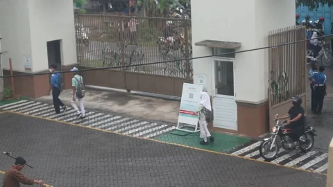 High school students enter the school gate. Footage taken in Java Indonesia Stock Footage 203820884