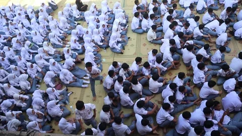 High school students gather in their schoolyard before class. Stock Footage 343827619