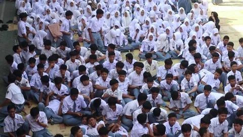 High school students gather in their schoolyard before class. Stock Footage 343827801