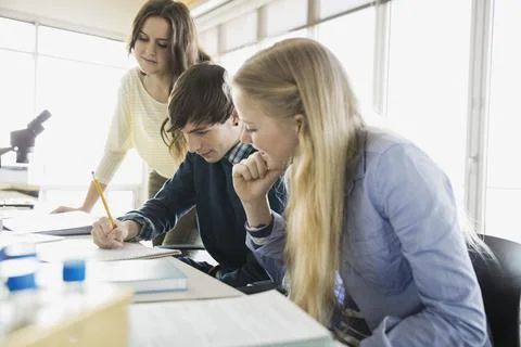 High school students problem solving in classroom Stock Photos