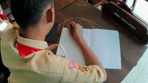 High school students in Scout uniforms are doing a writing assignment 스톡 동영상 242819858