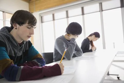High school students taking test in classroom Stock Photos