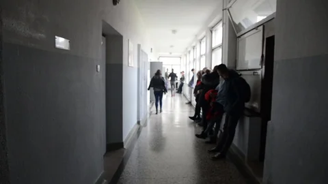 High school students talking in a school passage Video stock 98662205