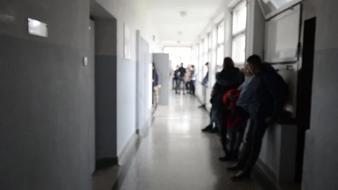 High school students talking in a school passage Video stock 98662251