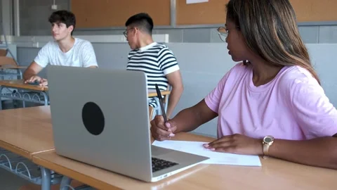 High school students throw paper ball to classmate. Boys laugh. 4k video Stock Footage 220697189