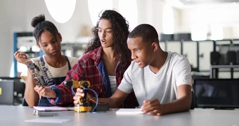High school students working on a robotic arm in class Stock Footage 93143408
