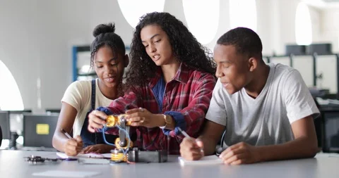High school students working on a robotic arm in class Video stock 93144353