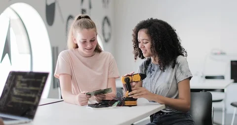 High school students working on a robotic arm in class Stock Footage 116659535
