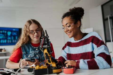 High school students working on robotics project. Girls in STEM. Stock Photos