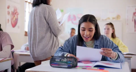 High school, teacher and happy girl with test results, education success and Stock Footage 249240988