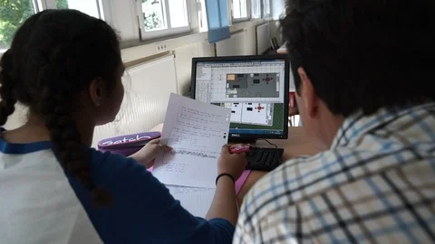 High School Teacher Helps Student with Design Computer Assignment Vídeos de archivo 87202492