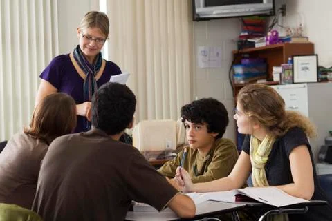 High school teacher leading study group Stock Photos