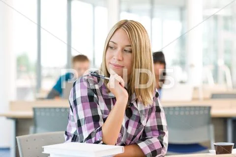 High school - thoughtful female student in classroom Stock Photos